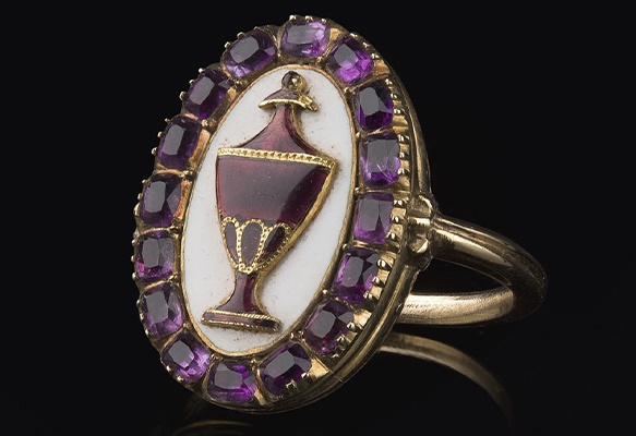 A George IV enamel and amethyst mourning ring